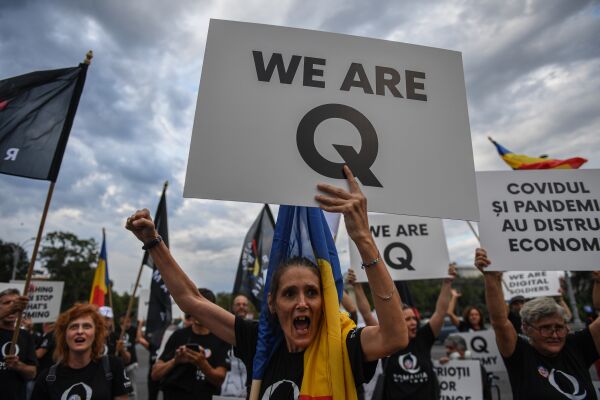 Qanon - © APA/AFP/Daniel MIHAILESCU